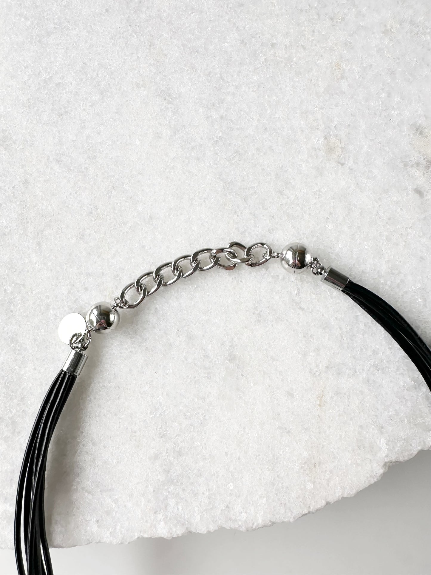 This 2” Extender Chain is Silver-toned and fits with round magnetic clasps on various Wanted Jewelry Necklaces.