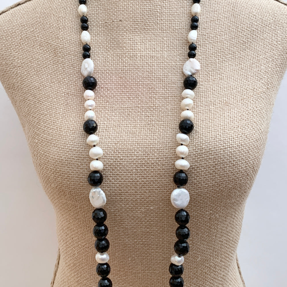 
                      
                        Large White Baroque and Coin Freshwater Pearls Adorn this Necklace with 8-14mm Faceted Black Agate. On Bust
                      
                    