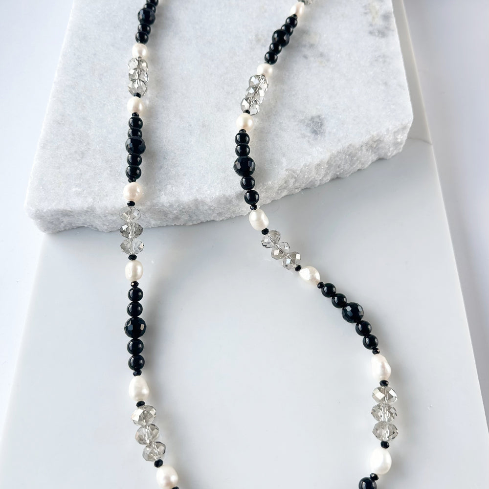This One Of A Kind, Distinctive 38” Necklace (with 1.5” Extender) has Lustrous White Freshwater Pearls, Smoky Faceted Crystals and deep Black Agate. Designed and made in Canada and Completed with a Lobster Claw Clasp, Style it Draped Long or Doubled for Layered Impact.