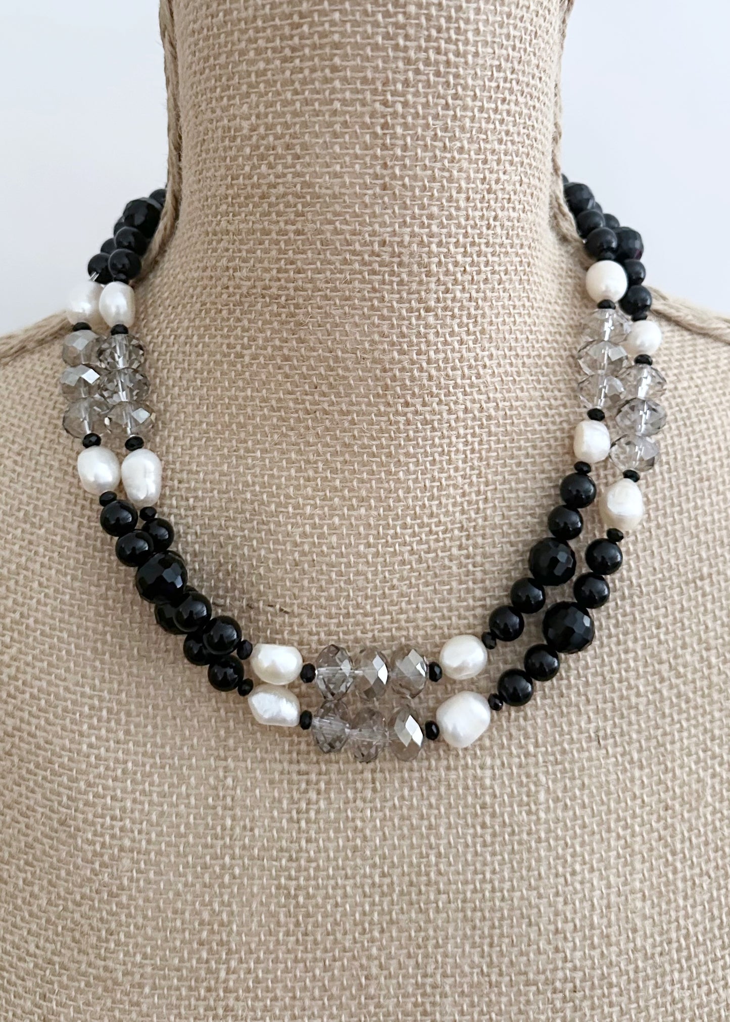 This One Of A Kind, Distinctive 38” Necklace (with 1.5” Extender) has Lustrous White Freshwater Pearls, Smoky Faceted Crystals and deep Black Agate. Designed and made in Canada and Completed with a Lobster Claw Clasp, Style it Draped Long or Doubled for Layered Impact.