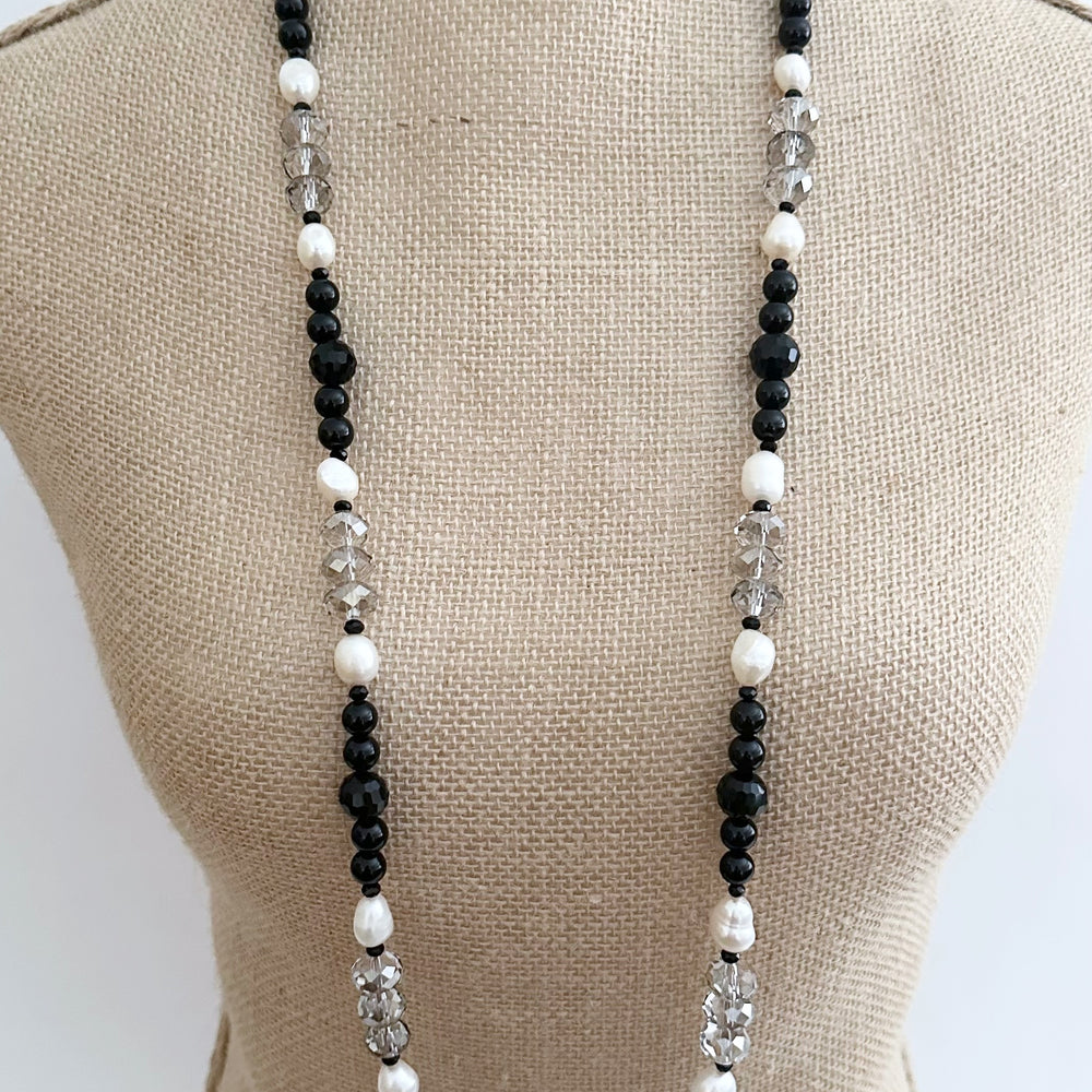 This One Of A Kind, Distinctive 38” Necklace (with 1.5” Extender) has Lustrous White Freshwater Pearls, Smoky Faceted Crystals and deep Black Agate. Designed and made in Canada and Completed with a Lobster Claw Clasp, Style it Draped Long or Doubled for Layered Impact.