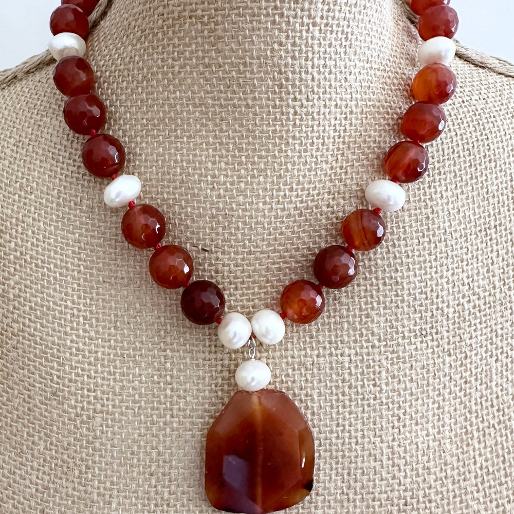 
                      
                        Large Freshwater Pearls Adorn this Necklace of Large (14mm) Carnelian with 2” Pendant and a Strong Secure Magnetic Clasp for Easy Wear. On Bust
                      
                    