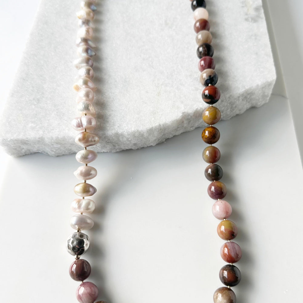 This Stunning, One-Of-A-Kind Piece has Large Baroque Soft Pink Freshwater Pearls with 14mm Petrified Wood in Brown Gold Rust and Pink for a 34” Necklace that is Completed by a Lobster Claw Clasp and Accented by Silver and Gold-Filled Beads.