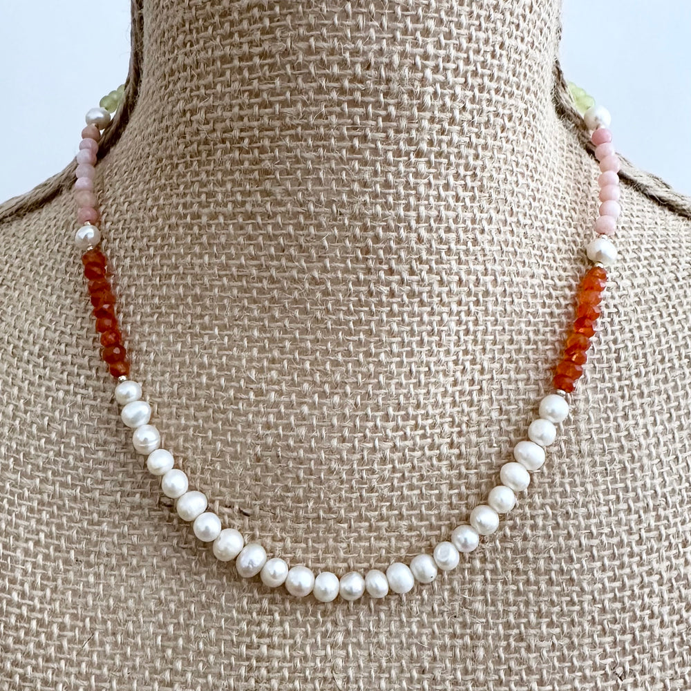 
                      
                        A Trio of Semi-Precious Stones, 5mm White Freshwater Pearls, Gold-Filled Beads and a Gold-Plated Rectangular Charm Clasp Combine to Make this 18” Necklace a One-Of-A-Kind Treat. harm Clasp at Back, On Bust
                      
                    