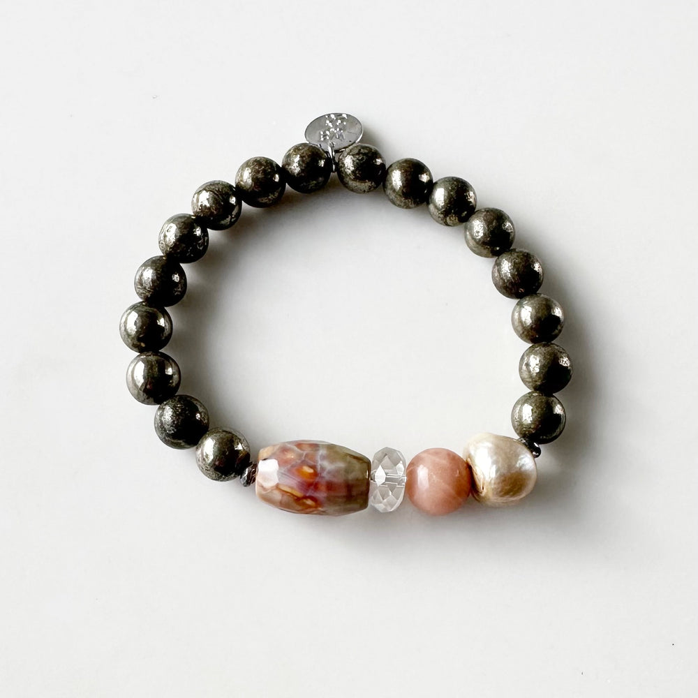 •	Fitting up to a 7” wrist, this Limited Edition Stretch Bracelet Boasts 8mm Pyrite, Freshwater Pearl, Moonstone, Quartz, Agate and Hematite.