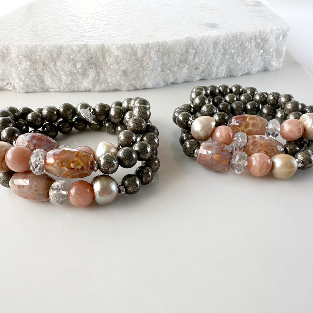 •	Fitting up to a 7” wrist, this Limited Edition Stretch Bracelet Boasts 8mm Pyrite, Freshwater Pearl, Moonstone, Quartz, Agate and Hematite. Two Shown