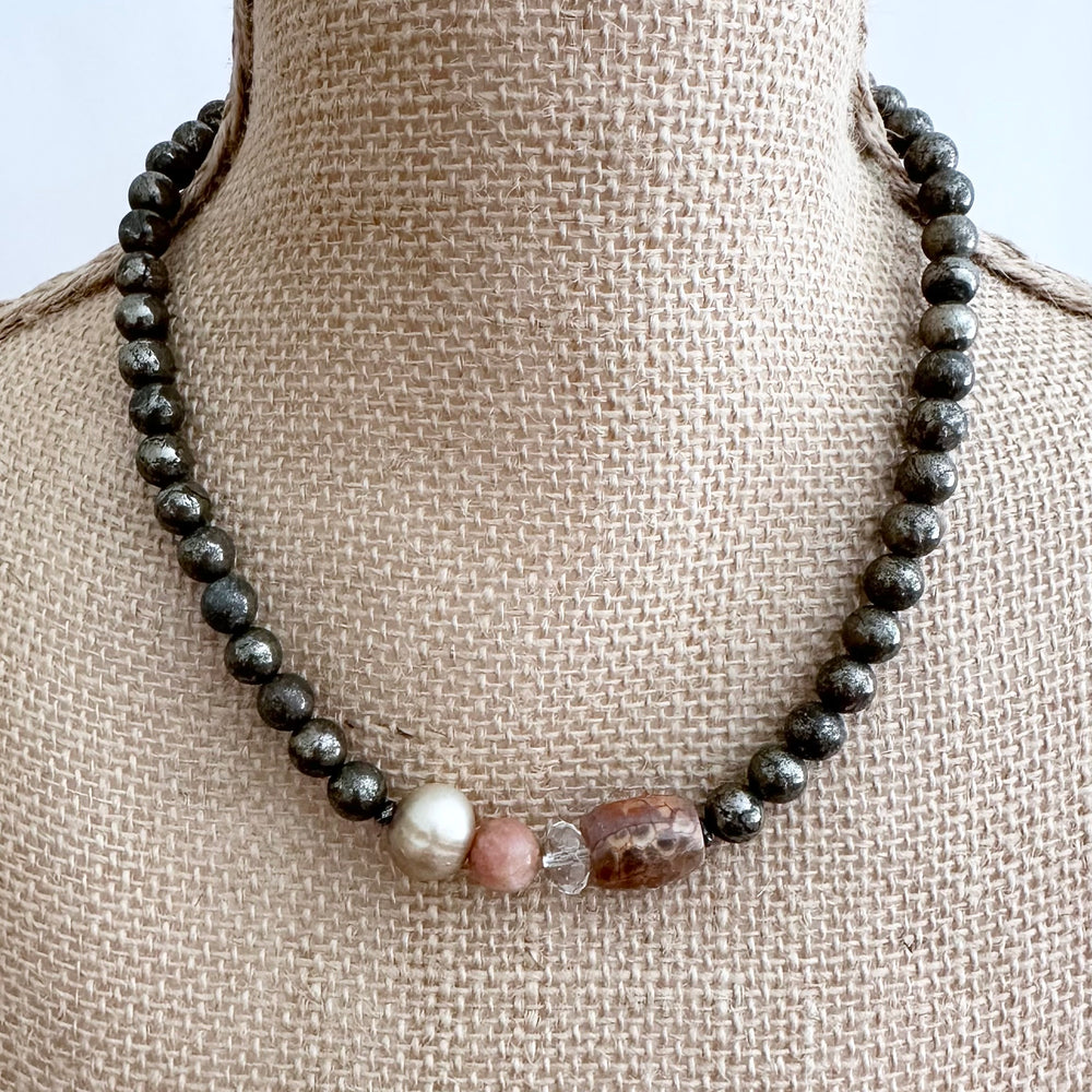 This 18.5” Limited Edition Necklace Boasts 8mm Pyrite, Gold Freshwater Pearl, Peach Moonstone, Clear Quartz, Brown-Scale Faceted Agate and Hematite. On Bust