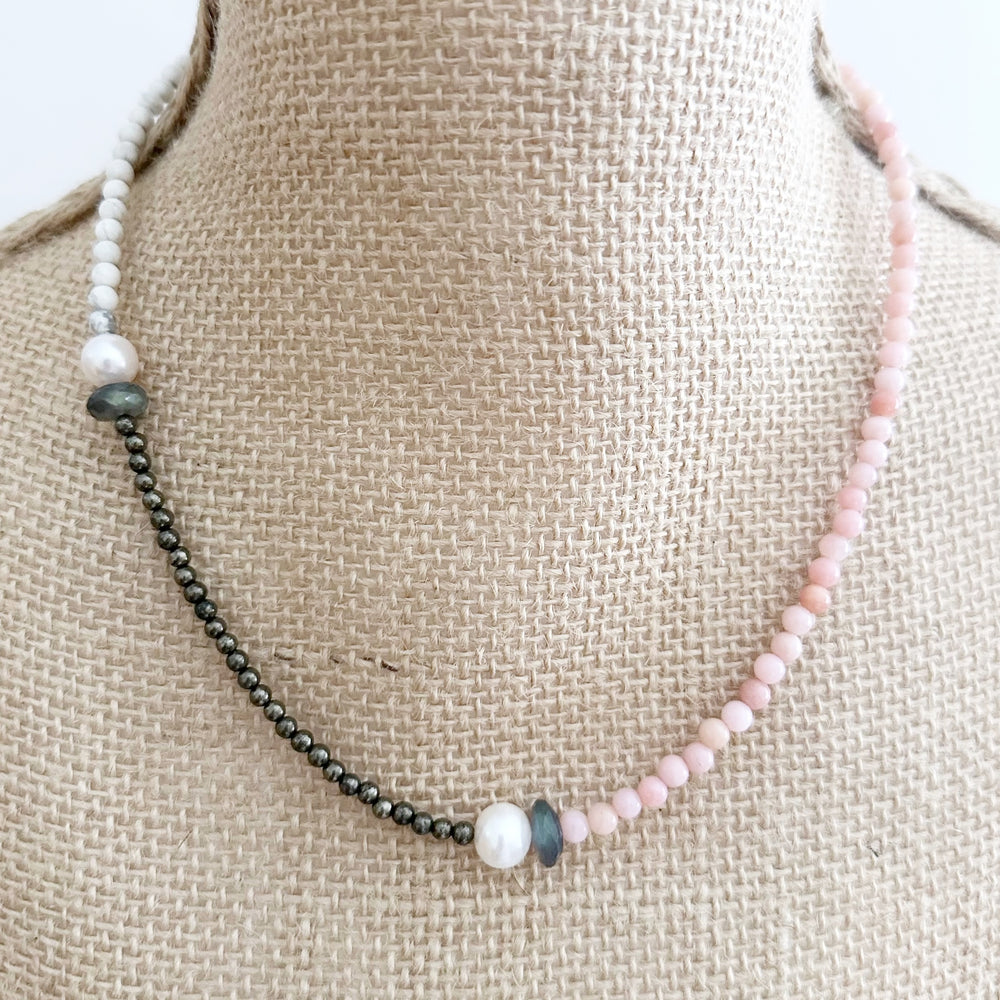 Two Lustrous White Freshwater Pearls Combine with Pink Opal, Pyrite, Howlite and Faceted Labradorite in this 19” One-Of-A-Kind Necklace Completed with Sterling Silver Lobster Claw Clasp. On Bust