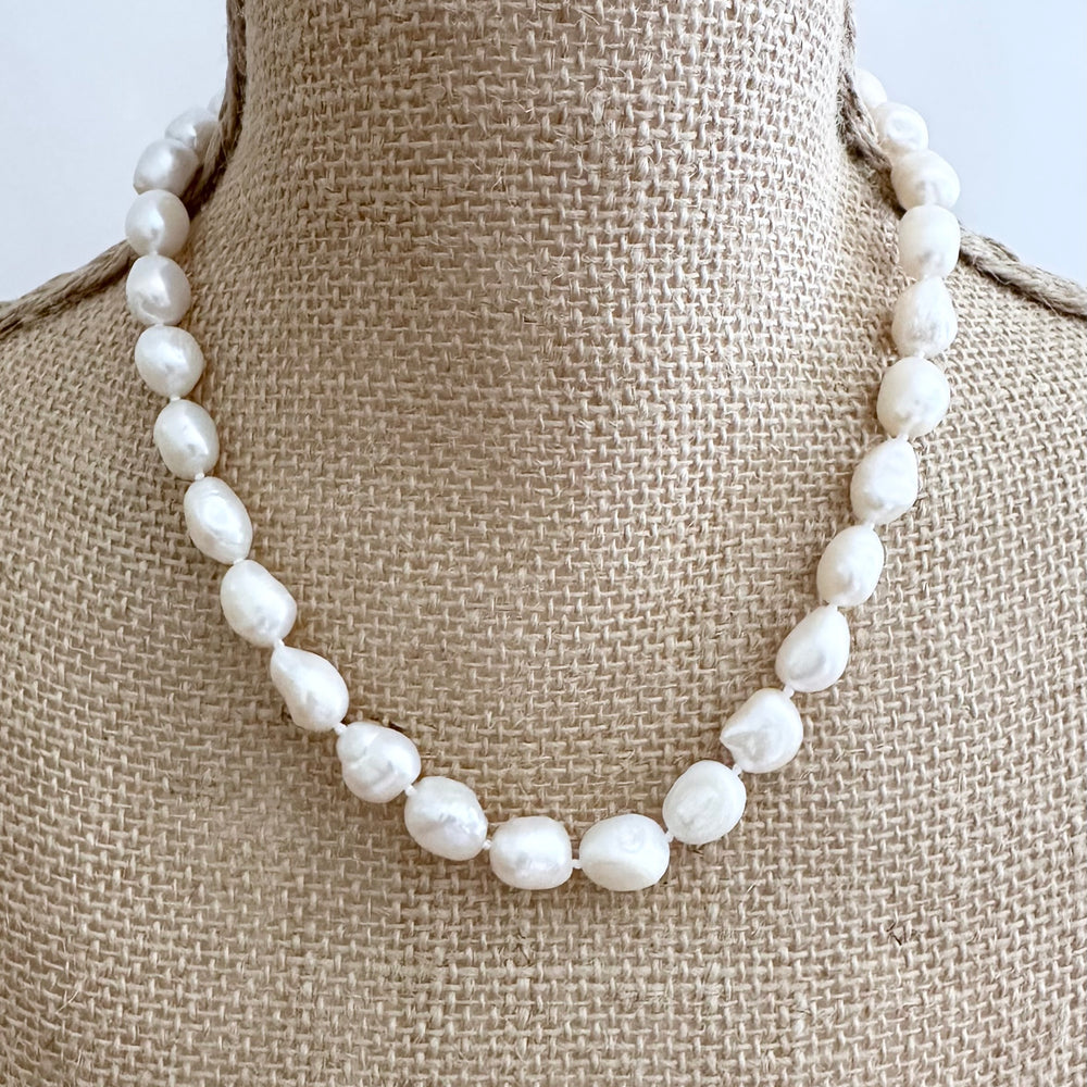 
                      
                        Lustrous Baroque Freshwater Pearls are Knotted in White  with a Gold Charm Clasp to Place your Favorite Pendants.  And Wear the 18.5” Necklace in Reverse to show off the Classic Pearls. On Bust
                      
                    