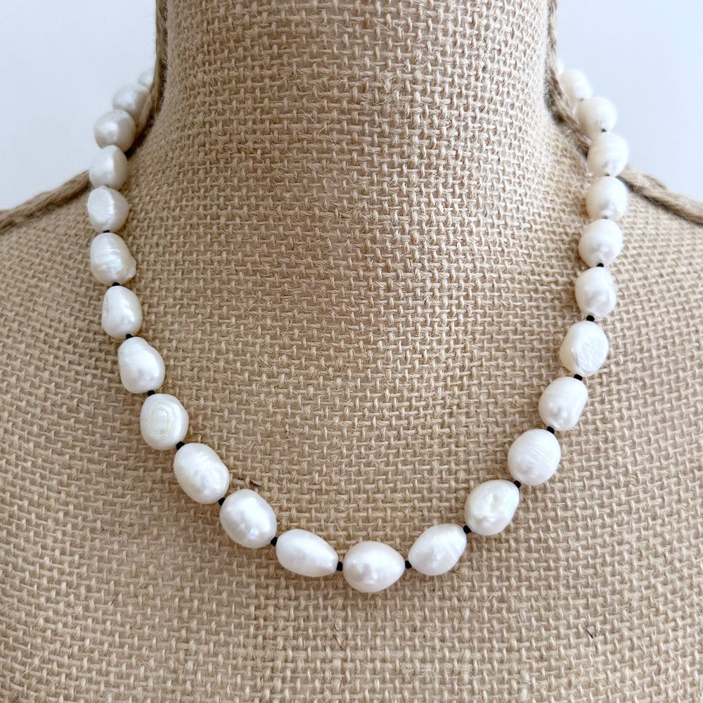 
                      
                        Lustrous Baroque Freshwater Pearls are Knotted in Black with a Silver Charm Clasp to Place your Favorite Pendants.  And Wear the 18.5” Necklace in Reverse to show off the Classic Pearls. On Bust
                      
                    