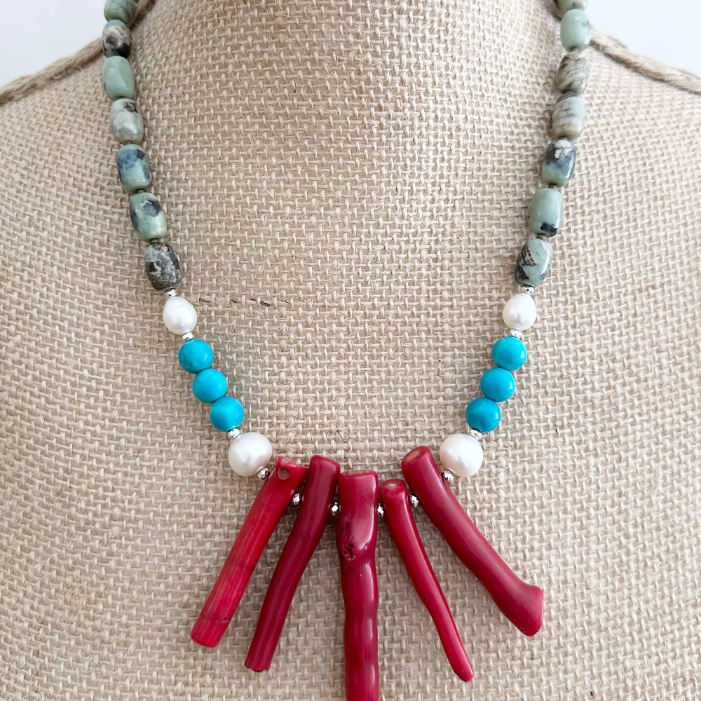 This 21” Statement Necklace Boasts Red Sea Bamboo, Terra Agate, Turquoise and Beautiful White Freshwater Pearls and are finished with Silver Beads and a Magnetic Ball Clasp for Easy Wear.