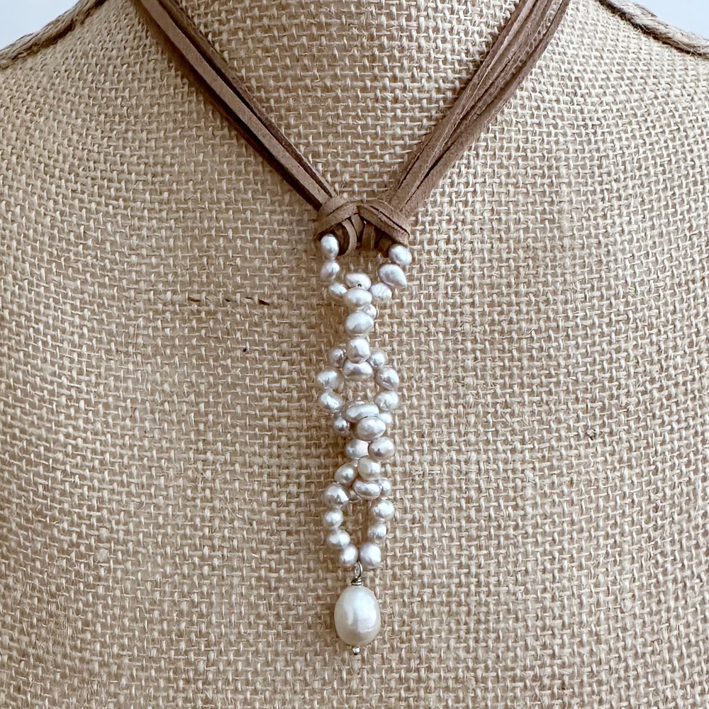 
                      
                        Modern Fun Look with Champagne Freshwater Pearl Links and Baroque Pearl Drop Hanging from Four Strands of Beige Vegan Suede Completed with a Strong Secure Magnetic Clasp for Easy Wear. On Bust
                      
                    