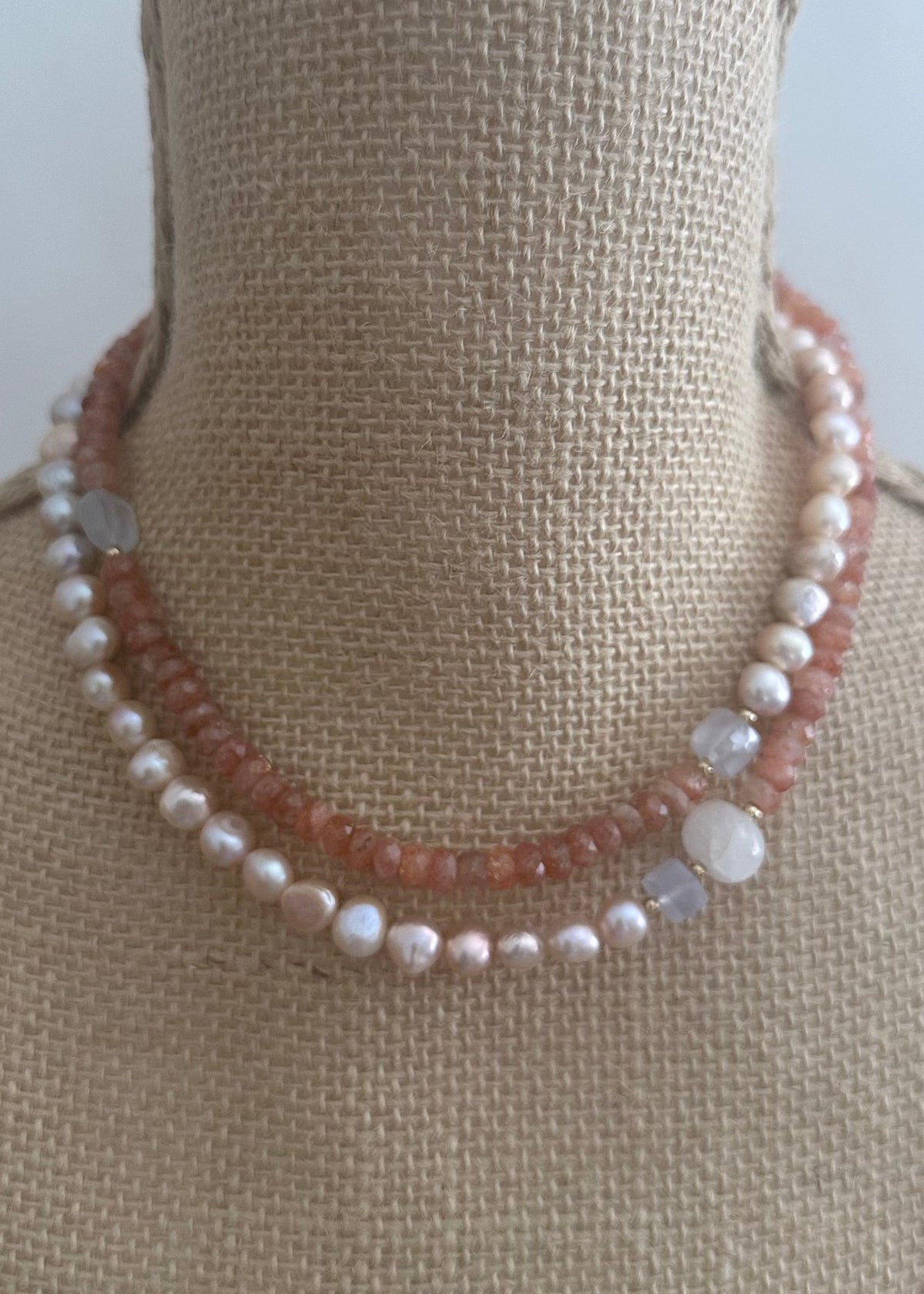 Designed and made in Canada, this beautiful one-of-a-kind 34” Necklace has a mix of sparkly Faceted Sunstone, light Blue Chalcedony and pink Baroque Pearls accented with tiny Gold beads and is finished with a Gold-plated Clasp. Wear it long or doubled.