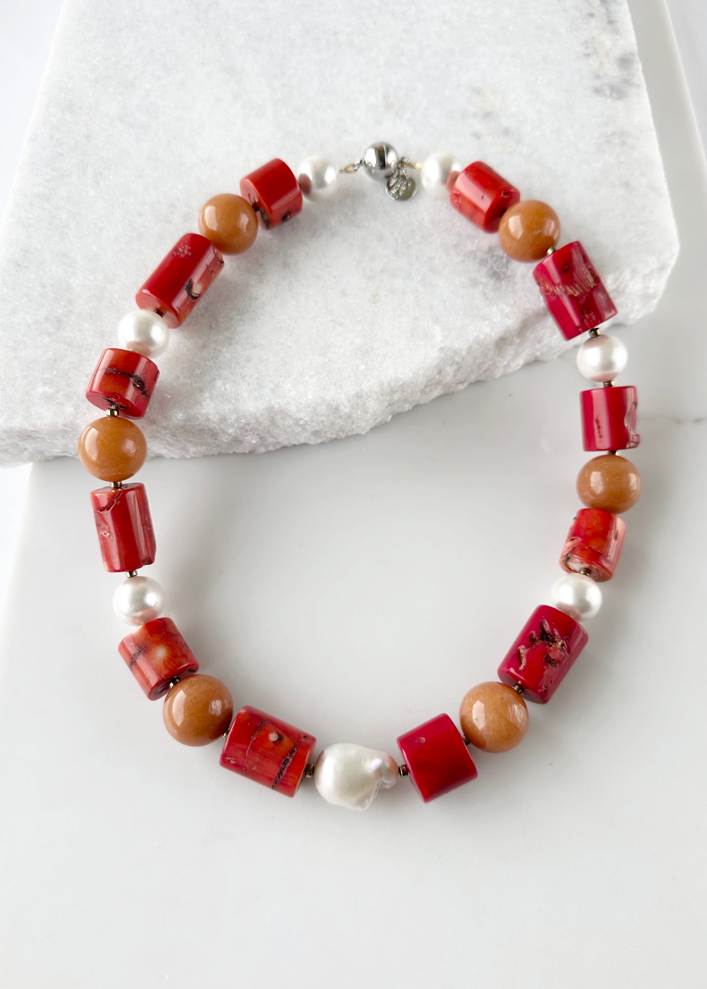 This Unique 21” Necklace Features Vibrant Red Sea Bamboo, Orange Aventurine, Shell Pearls and a Beautiful Baroque Freshwater Pearl Finished with a Strong, Secure Magnetic Clasp for Easy Wear.