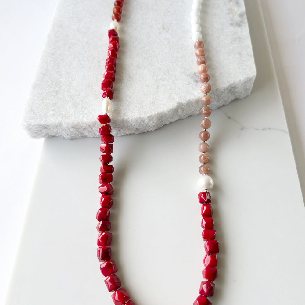 This 38” Long and Beautiful Necklace Boasts a Rich Blend of Colours including Vibrant Red Sea Bamboo, Soft Peach Moonstone, Faceted Carnelian, Crisp White Agate and Elegant White Freshwater Pearls.  The Necklace is finished with Gold and Silver Beads and a Sterling Silver Lobster Claw Clasp and can be Worn Long or Doubled Up.