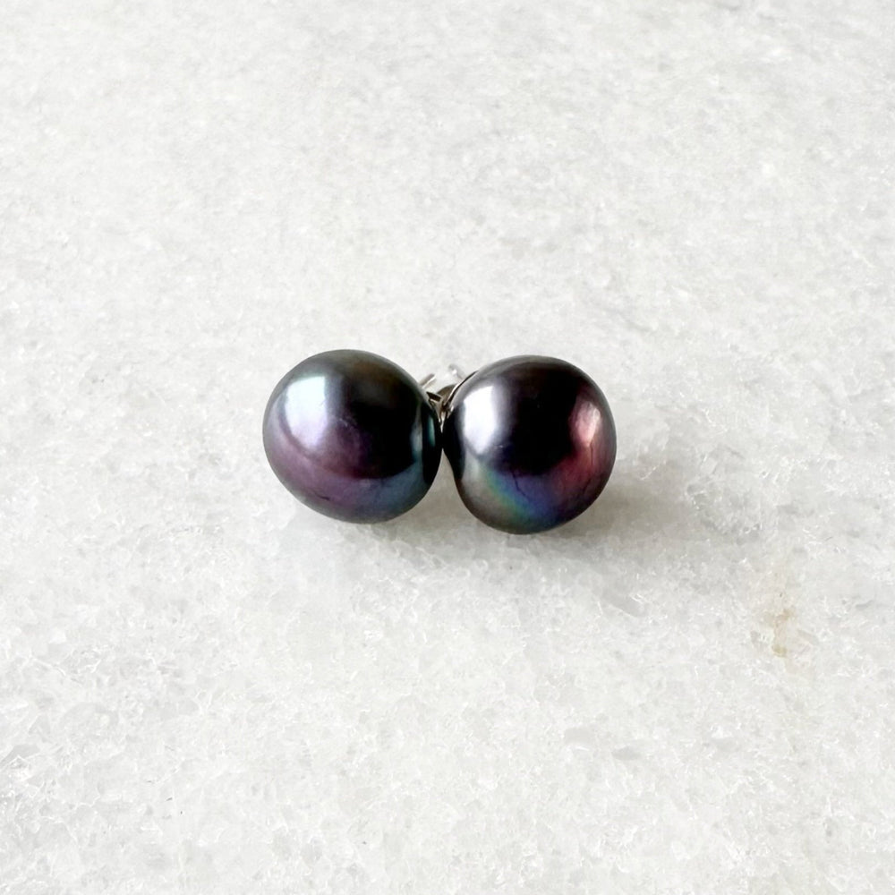 
                      
                        These Pretty Black 10-11mm Freshwater Pearl Stud Earrings are on Sterling Silver Post and Butterfly.  A Fan Favorite!
                      
                    