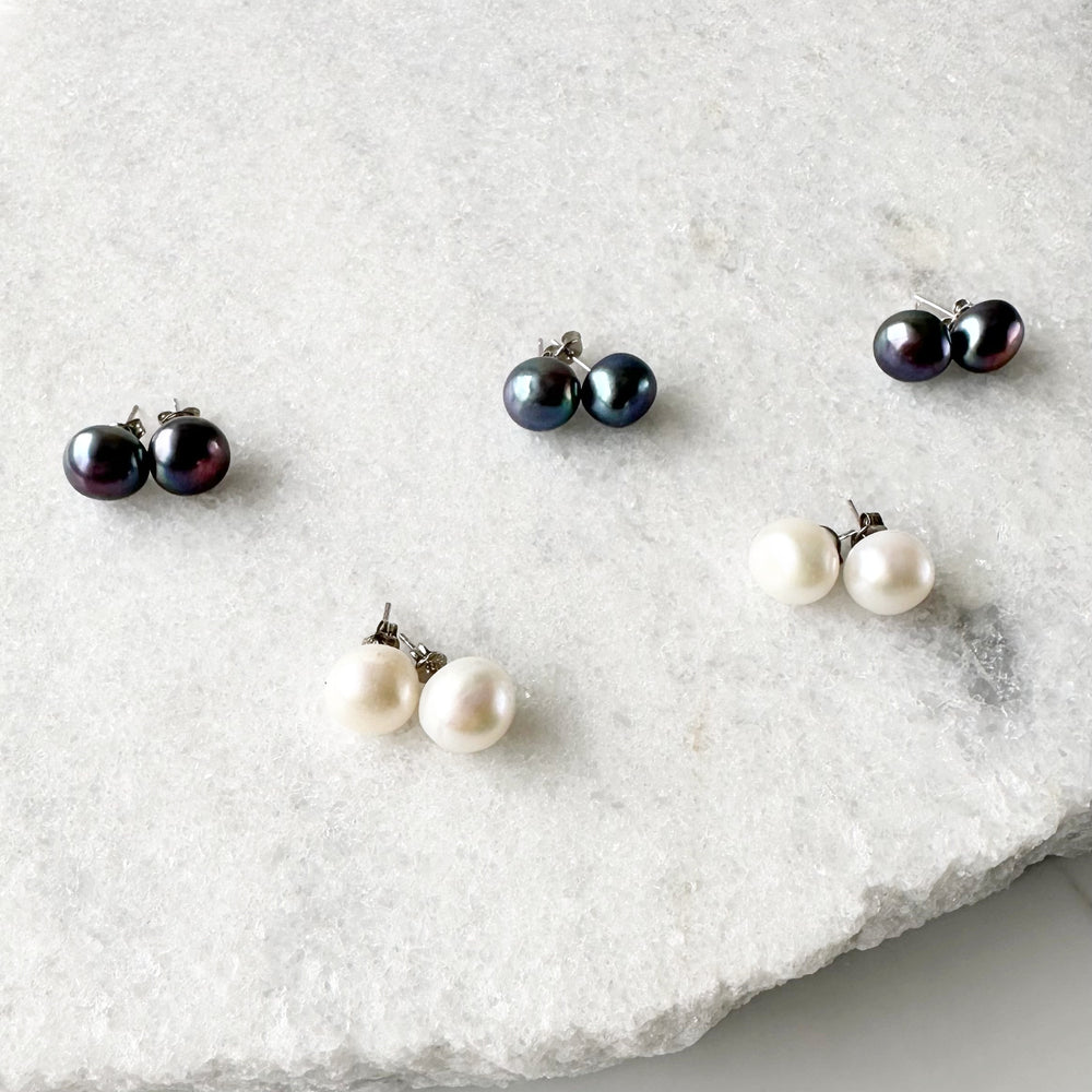 
                      
                        These Pretty Black or White 10-11mm Freshwater Pearl Stud Earrings are on Sterling Silver Post and Butterfly.  A Fan Favorite!
                      
                    