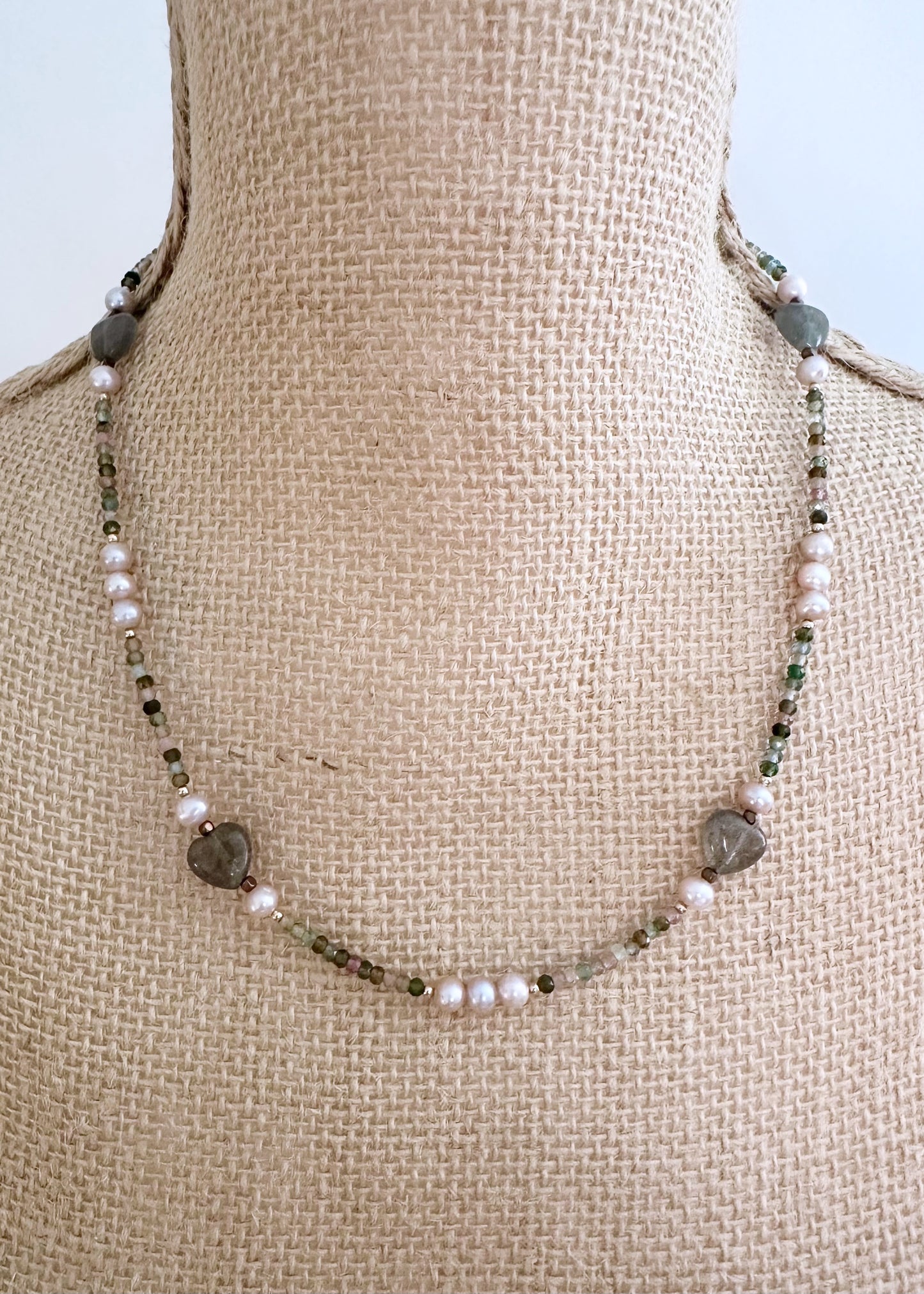 Designed and made in Canada, this Delicate, One-Of-A-Kind 17.5” Necklace Features Faceted 3mm Tourmaline, Charming Labradorite 10mm Hearts and Pretty Pink 5mm Pearls accented with Gold-Filled Beads and Completed with a Gold-Filled Lobster Claw Clasp.