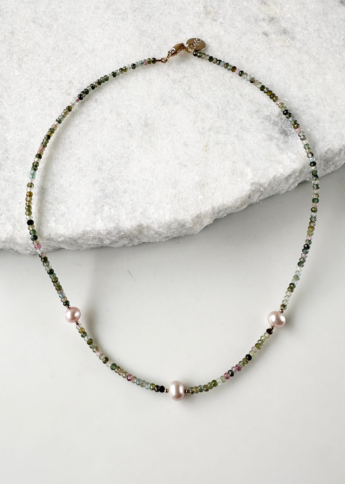 Designed and made in Canada, this charming One-Of-A-Kind 18” Necklace features Tiny, Faceted Tourmaline in shades of Pink and Green accented with Beautiful Pink Pearls and a touch of gold, then Finished with a Gold-filled Lobster Claw Clasp