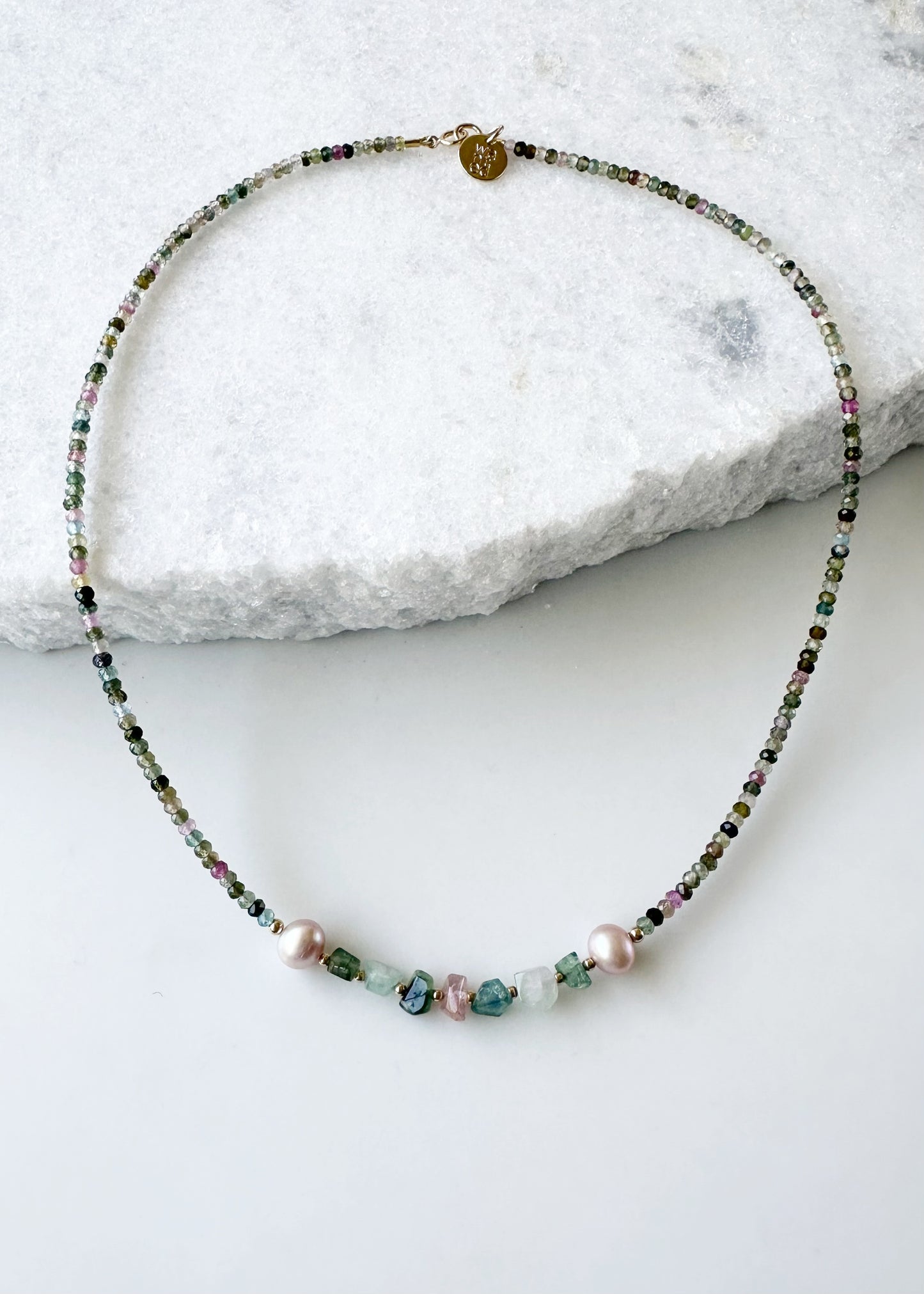 Designed and made in Canada, this charming One-Of-A-Kind 18” Necklace Features Tiny (3mm) Faceted Tourmaline in Shades of Pink and Green and Tourmaline Nuggets accented with Beautiful Pink Pearls and fine(2mm) Gold-Filled beads. The piece is finished with a Gold-Filled Spring Ring Clasp