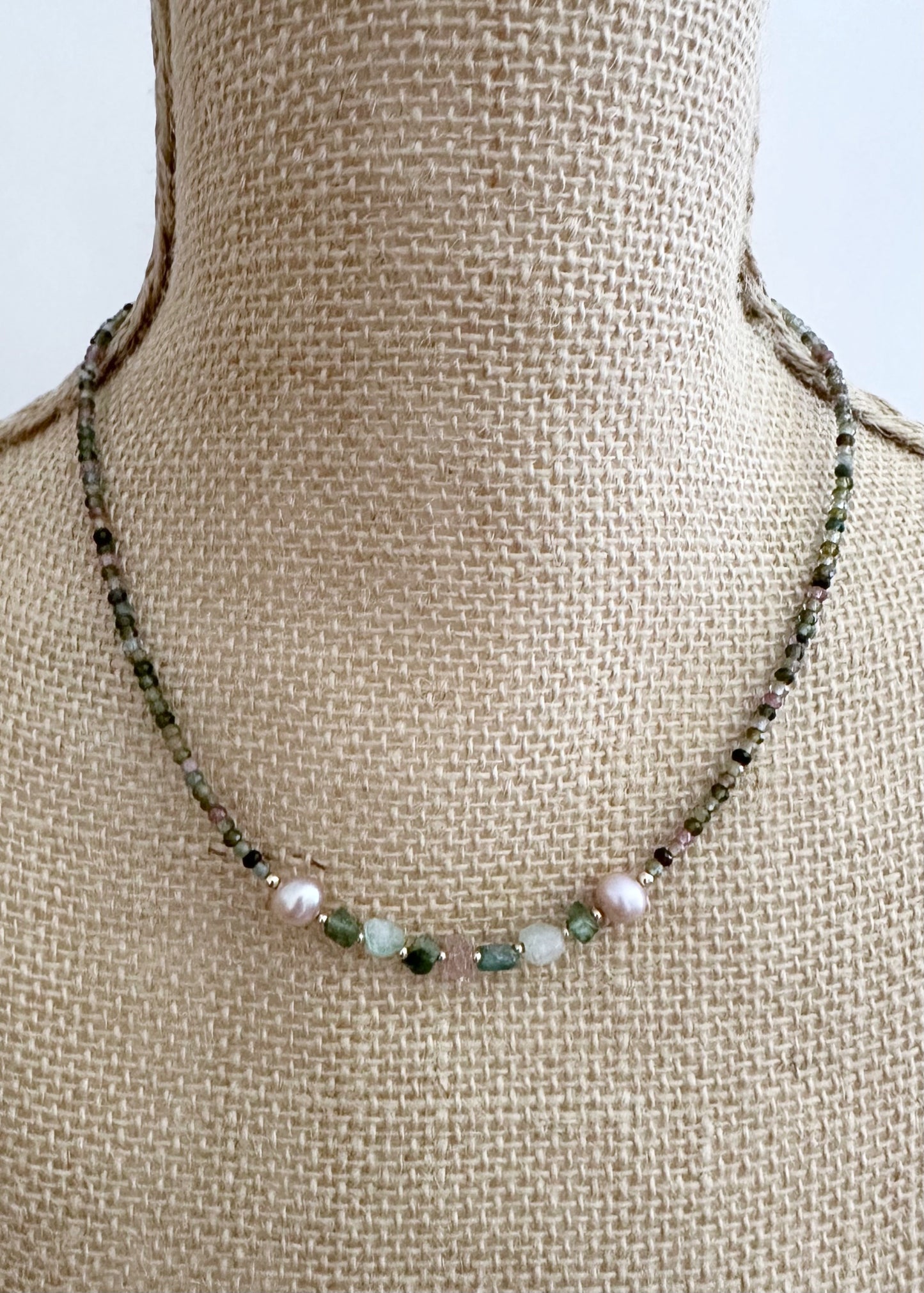 Designed and made in Canada, this charming One-Of-A-Kind 18” Necklace Features Tiny (3mm) Faceted Tourmaline in Shades of Pink and Green and Tourmaline Nuggets accented with Beautiful Pink Pearls and fine(2mm) Gold-Filled beads. The piece is finished with a Gold-Filled Spring Ring Clasp