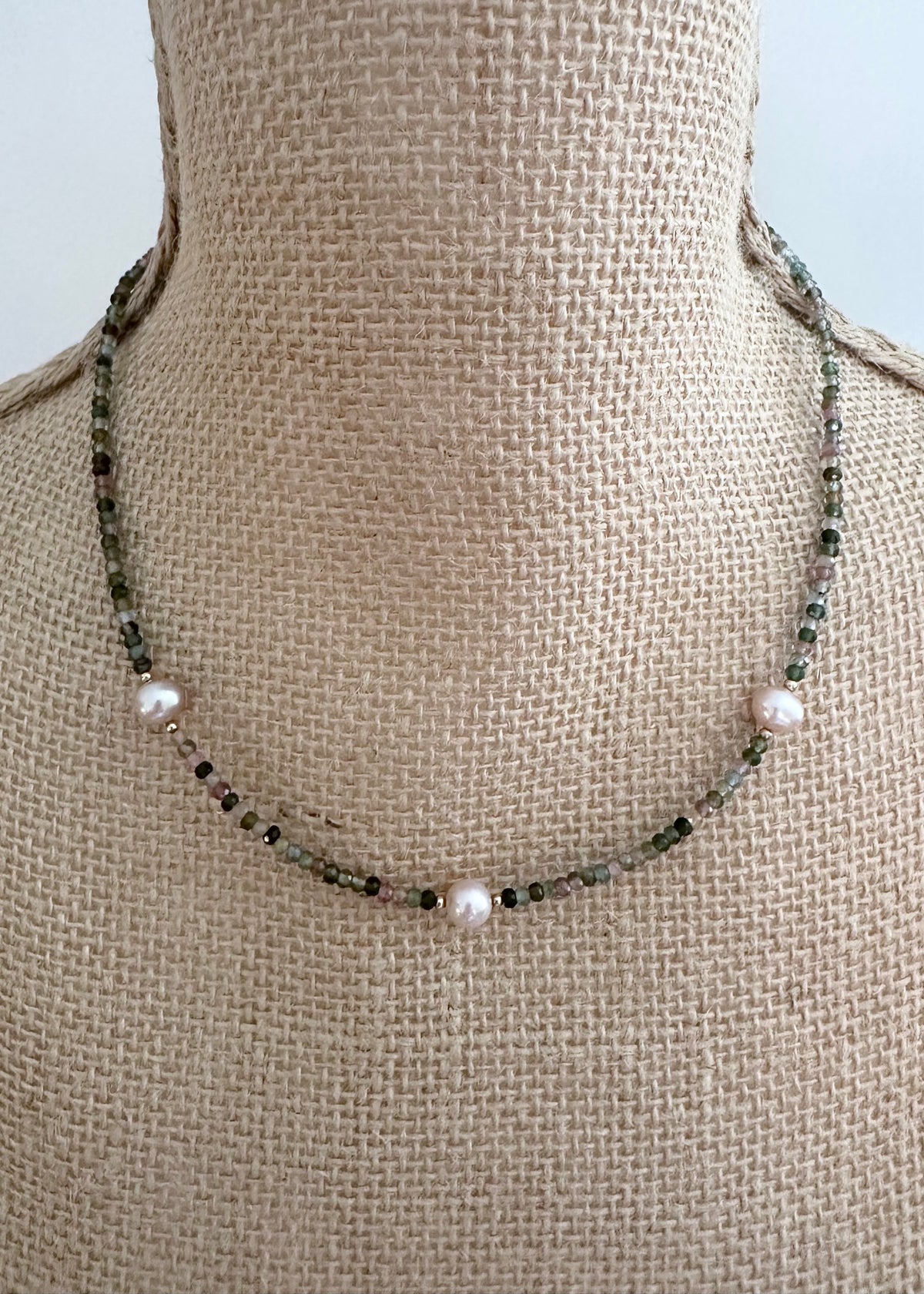 Designed and made in Canada, this charming One-Of-A-Kind 18” Necklace features Tiny, Faceted Tourmaline in shades of Pink and Green accented with Beautiful Pink Pearls and a touch of gold, then Finished with a Gold-filled Lobster Claw Clasp