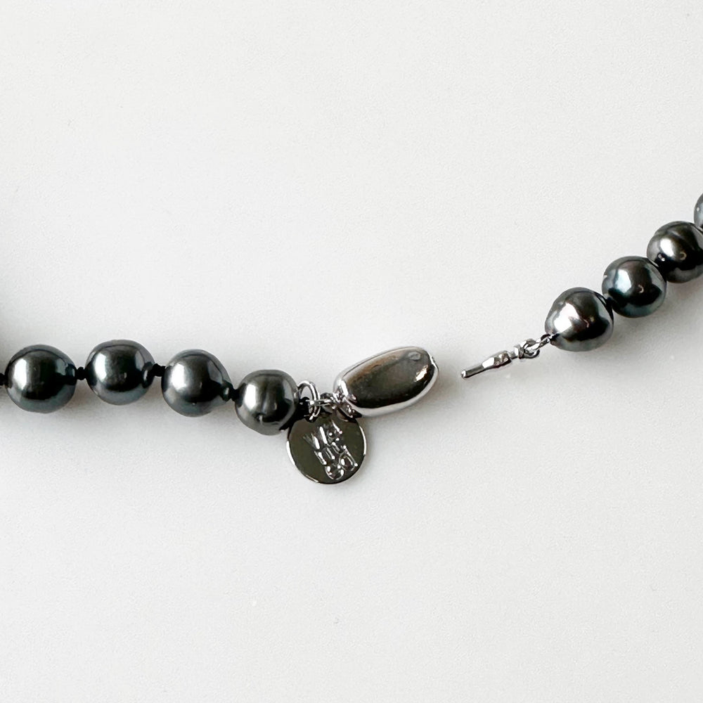 
                      
                        Gorgeous Graduated Strand of 9-11mm Baroque Tahitian Pearls on 18” Necklace with Sterling Silver Bean Clasp.  One Available at this Terrific Piece! Clasp Open in Focus
                      
                    