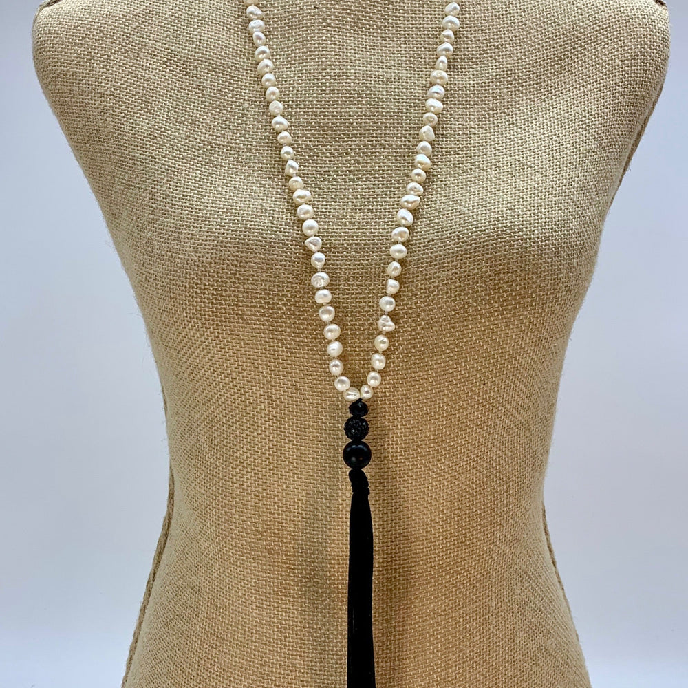 
                      
                        Freshwater Baroque White 8-9mm Pearls with Agate and Crystal and a Vegan Suede Tassel in Long 23” Necklace. Great on its own or Layered. on Bust
                      
                    