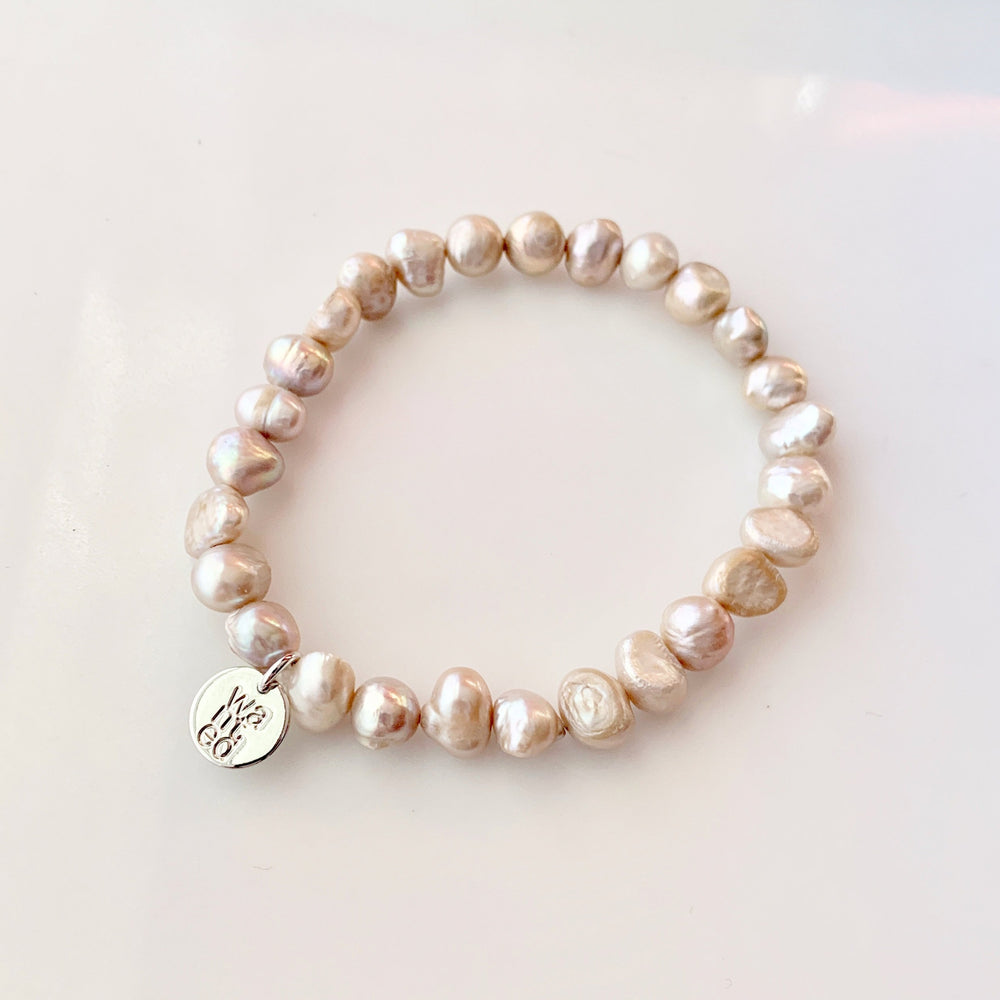 
                      
                        Pretty Stretch Bracelet with Baroque Champagne Freshwater Pearls that can be Worn Alone or Stacked with your Other Favorites.
                      
                    