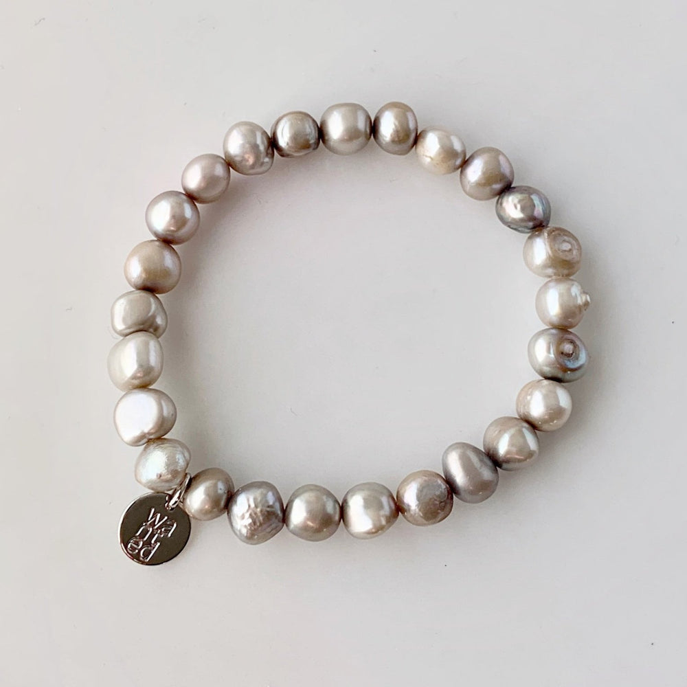 
                      
                        Pretty Stretch Bracelet with Baroque Silver Freshwater Pearls that can be Worn Alone or Stacked with your Other Favorites.
                      
                    