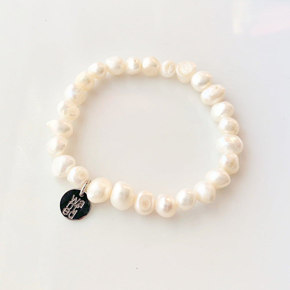 
                      
                        Pretty Stretch Bracelet with Baroque White Freshwater Pearls that can be Worn Alone or Stacked with your Other Favorites.
                      
                    