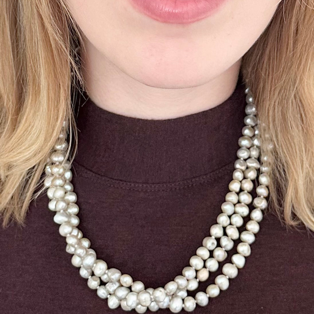 
                      
                        Three Strands of Knotted 8-9mm White Freshwater Baroque Pearls with a Strong Secure Magnetic Clasp for Easy Wear.
                      
                    