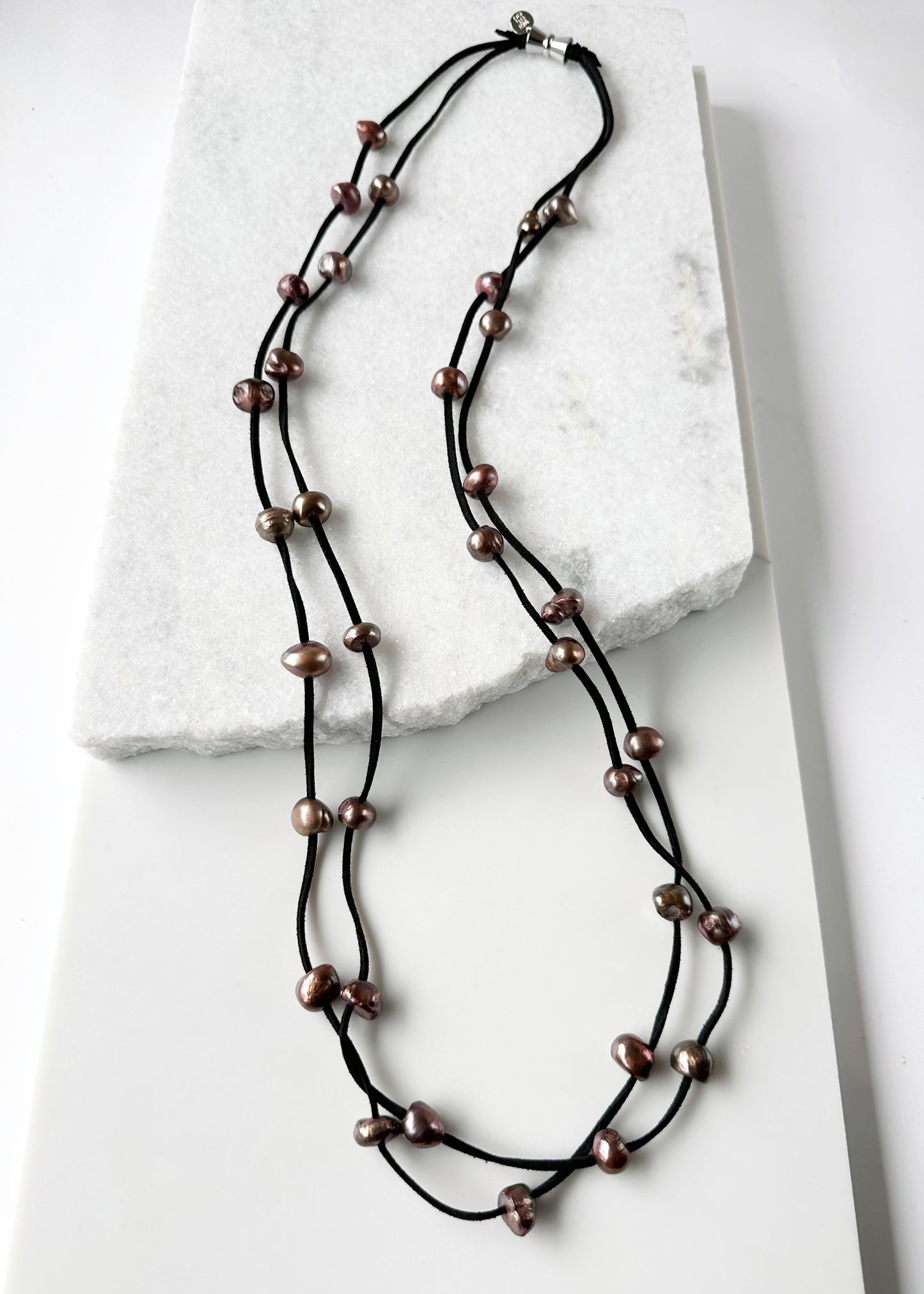 Large Baroque Freshwater Brown Pearls Floating on Two Strands of Black Vegan Suede for 40” Long Necklace Completed with Strong Secure Magnetic Clasp for Easy Wear.