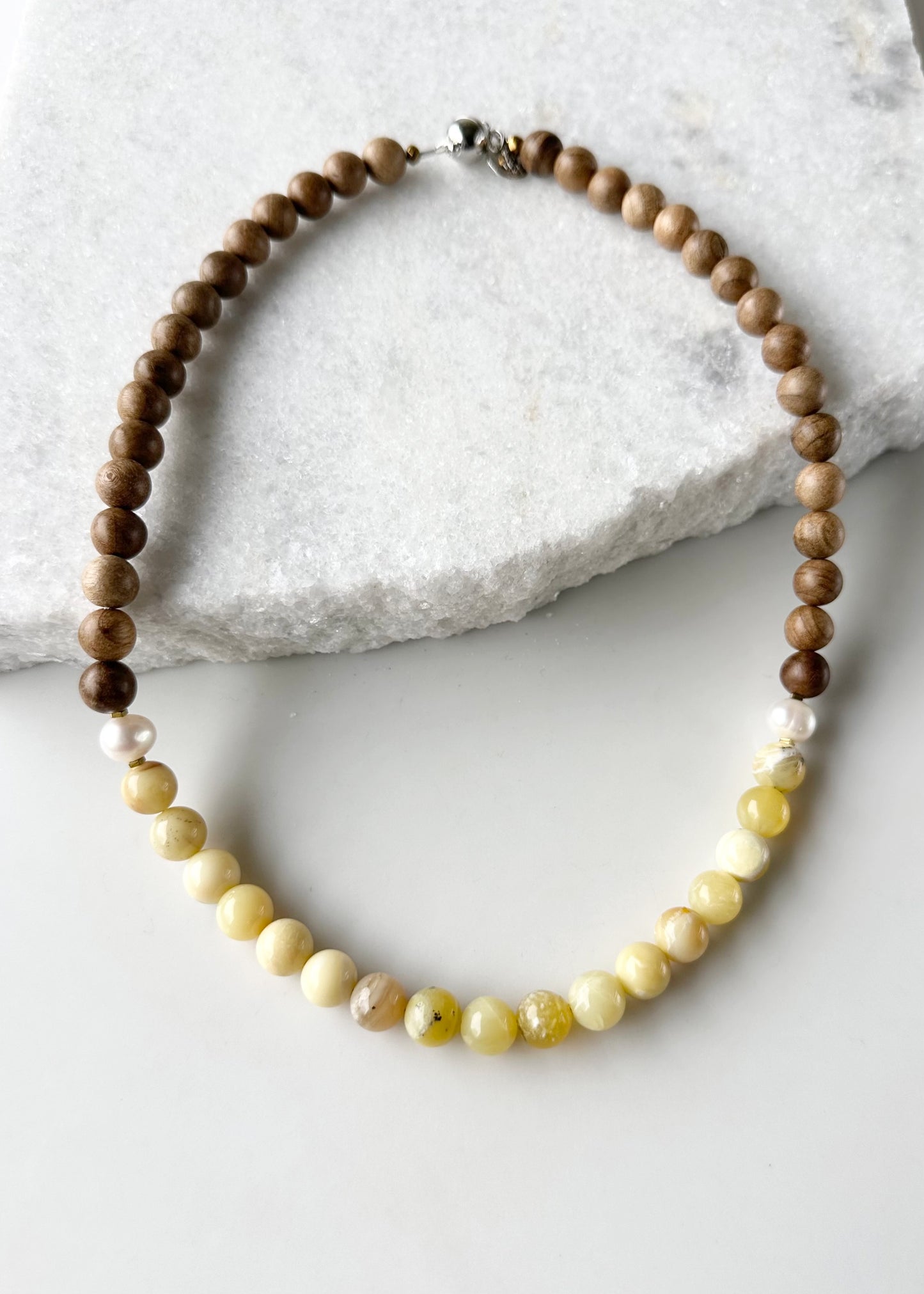 Designed and made in Canada, this Limited-Edition 20” Necklace Features Sunny Yellow Opal, Silkwood and Pearls Completed with Tiny Gold Accents and a Magnetic Clasp. This Gem brings an Elegant Touch of colour in a Lightweight Design that's Perfect for the Season.