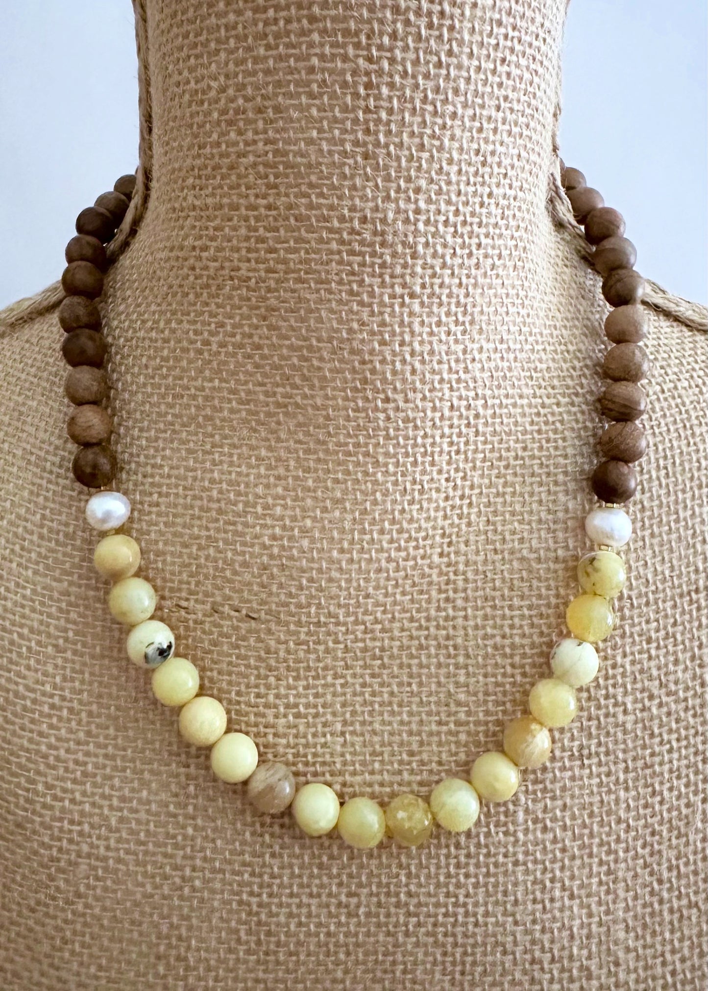 Designed and made in Canada, this Limited-Edition 20” Necklace Features Sunny Yellow Opal, Silkwood and Pearls Completed with Tiny Gold Accents and a Magnetic Clasp. This Gem brings an Elegant Touch of colour in a Lightweight Design that's Perfect for the Season.