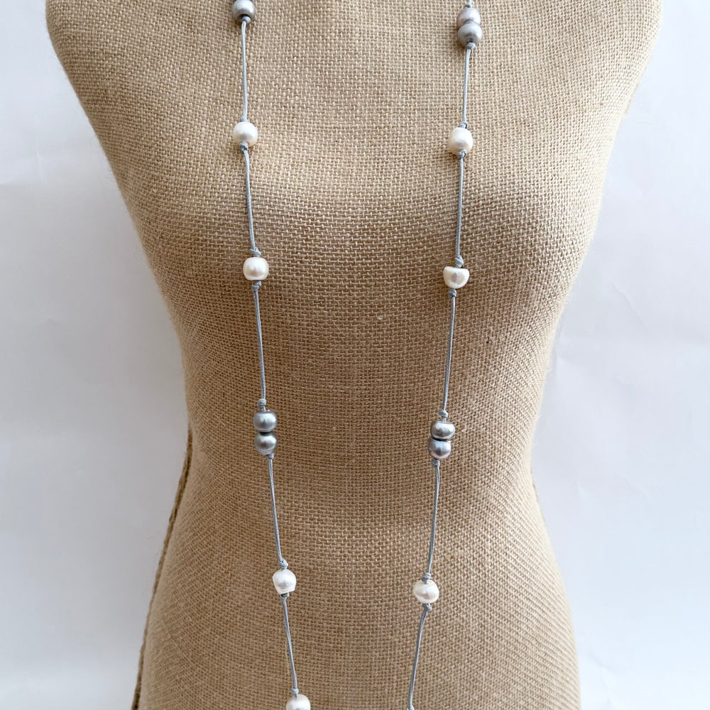 
                      
                        Freshwater Baroque Pearls Knotted on Grey Cord in 24” Necklace that Can be Worn Long or Doubled. On Bust
                      
                    