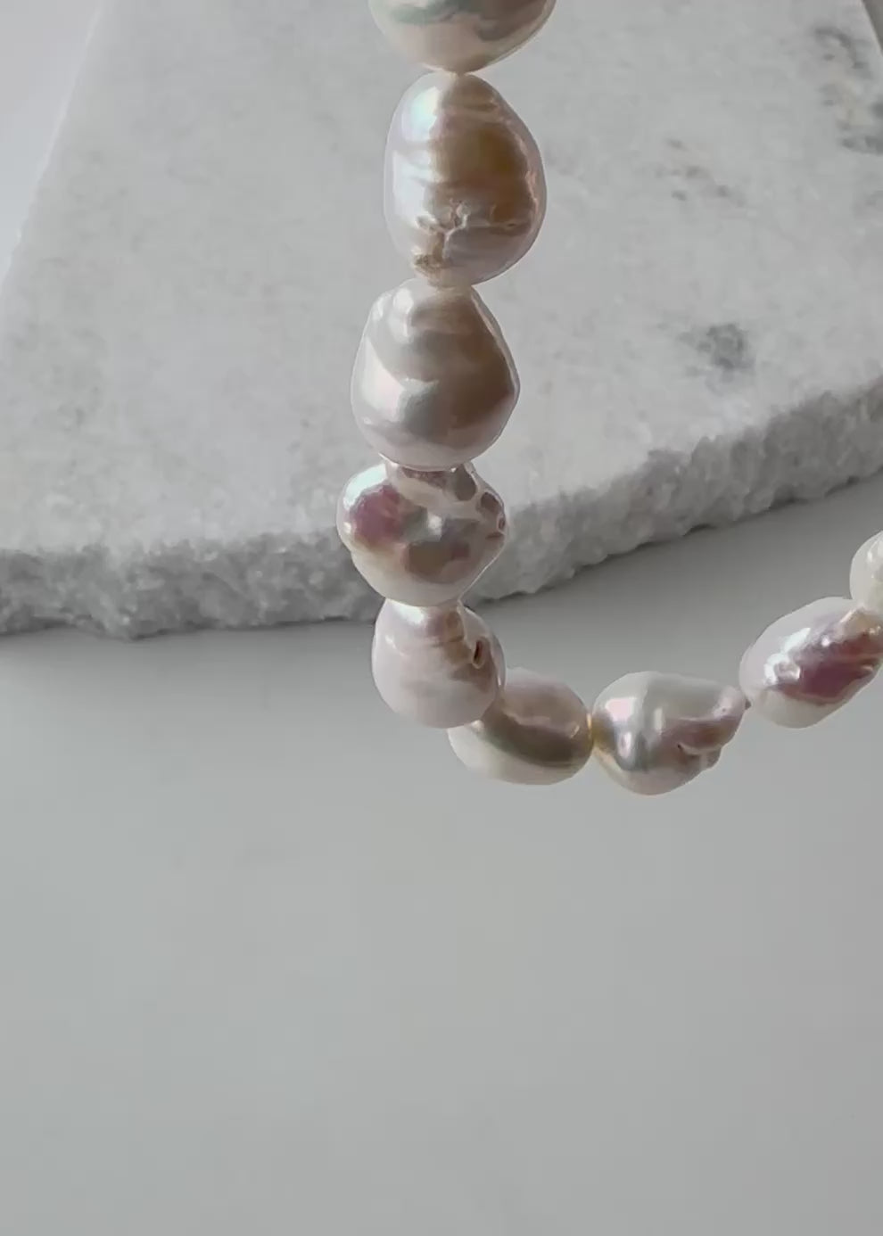 Designed in Canada, the gorgeous Isla 18.5” Necklace has Lustrous Medium-Sized (approximately 12mm x 17mm) Baroque Pearls that are Hand-Knotted. Each Pearl has a Unique Shape. This piece is finished with a White Gold-Plated Slot Clasp has a slot on each side and is very easy to attach.