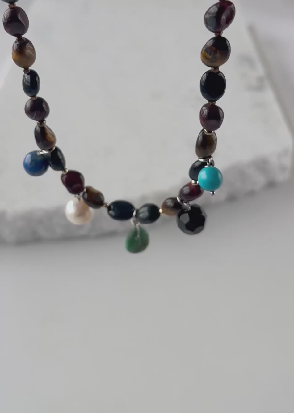 Designed and Made in Canada, this Limited Edition 21.5” Necklace Features Cheerful Turquoise, Lapis and Creamy White Pearl with Warm Tiger Eye Beads, creating a playful mix that's anything but ordinary. Perfect for those who love a little gemstone personality in their jewelry collection. The piece is completed with Gold Accents and a Magnetic Clasp. 