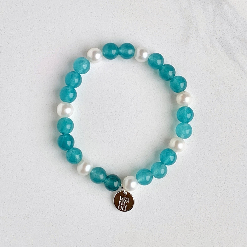 
                      
                        White Freshwater Pearl with Teal Agate Stretch Bracelet.  Perfect for layering!
                      
                    