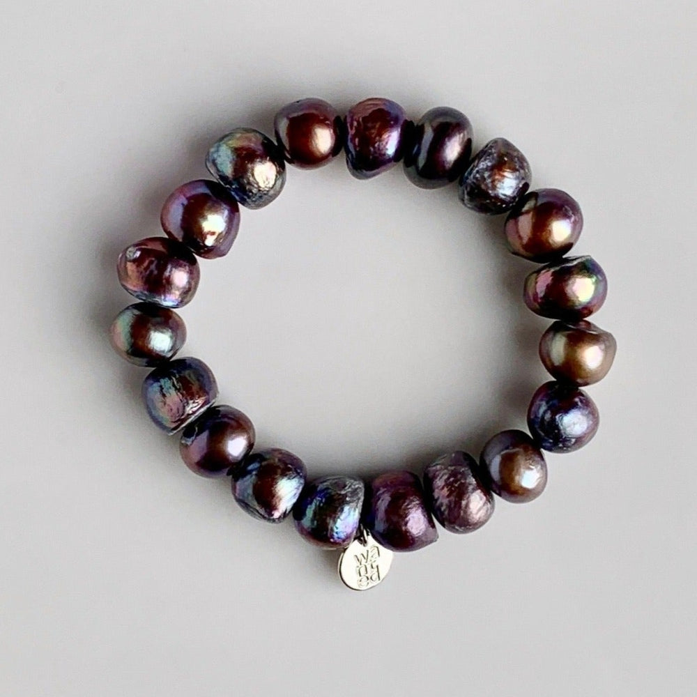 
                      
                        Large Baroque Black Freshwater Pearls are designed in this Stretch Bracelet. This can be worn by itself or Stacked with others.
                      
                    