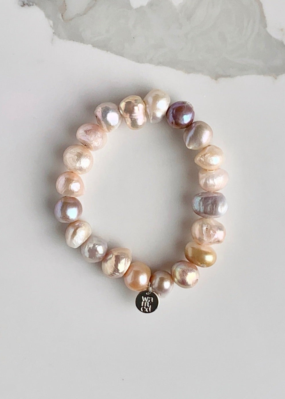 Large Baroque Natural Pink Freshwater Pearls are designed in this Stretch Bracelet. This can be worn by itself or Stacked with others.