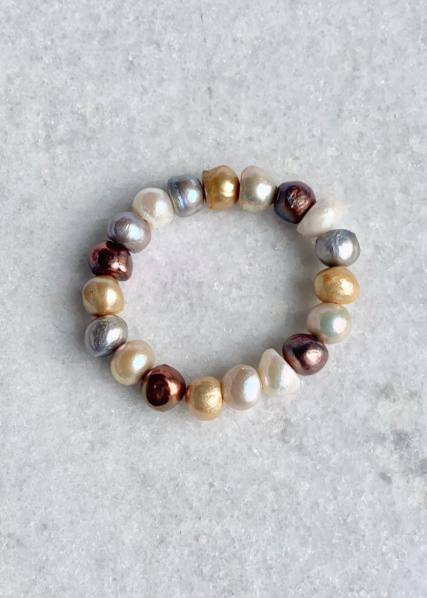 Large Baroque Colour Mix Freshwater Pearls are designed in this Stretch Bracelet. This can be worn by itself or Stacked with others.