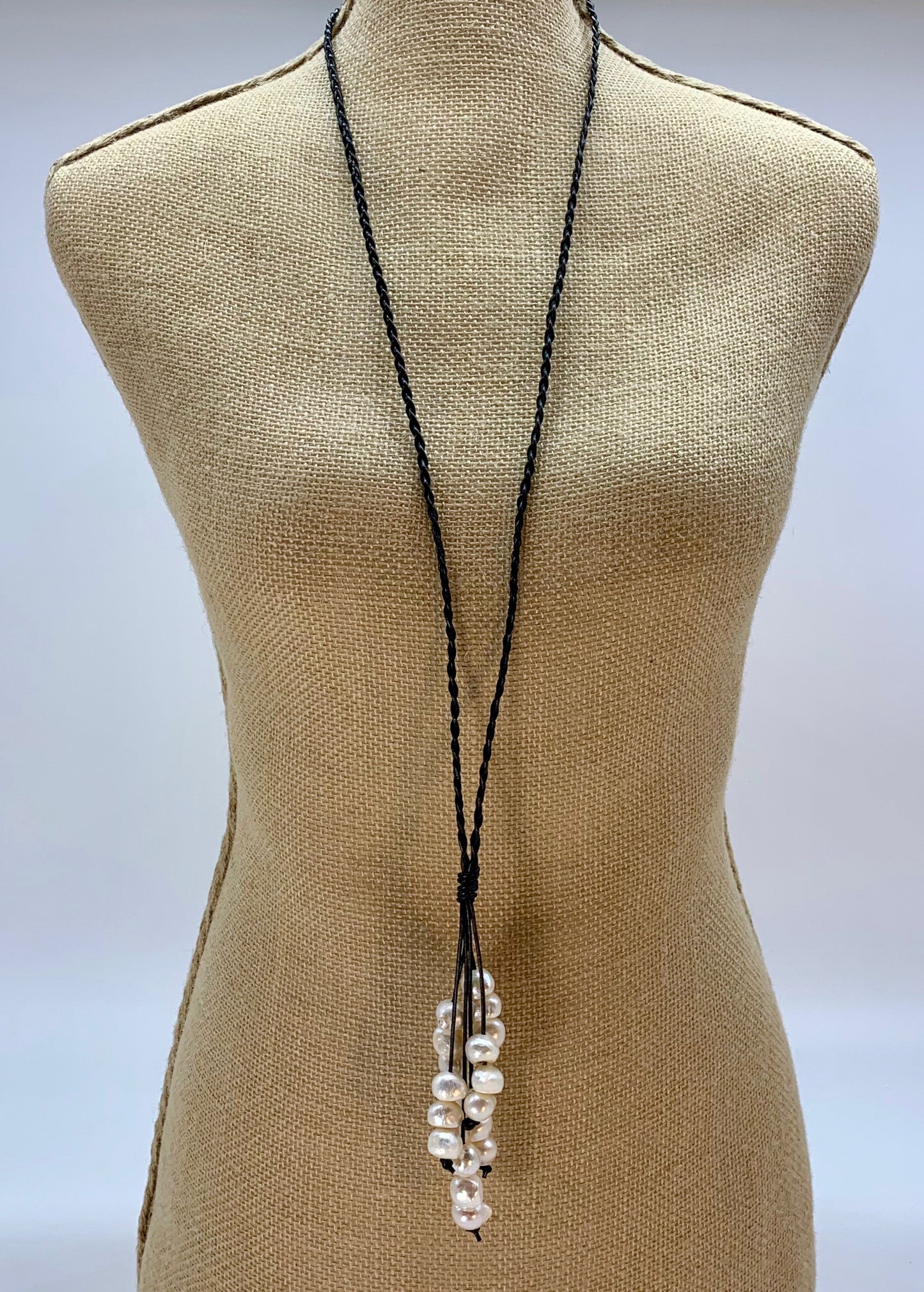 Large White Baroque Freshwater Pearls on Braided Black Leather for this Necklace with 23” Drop. On Bust