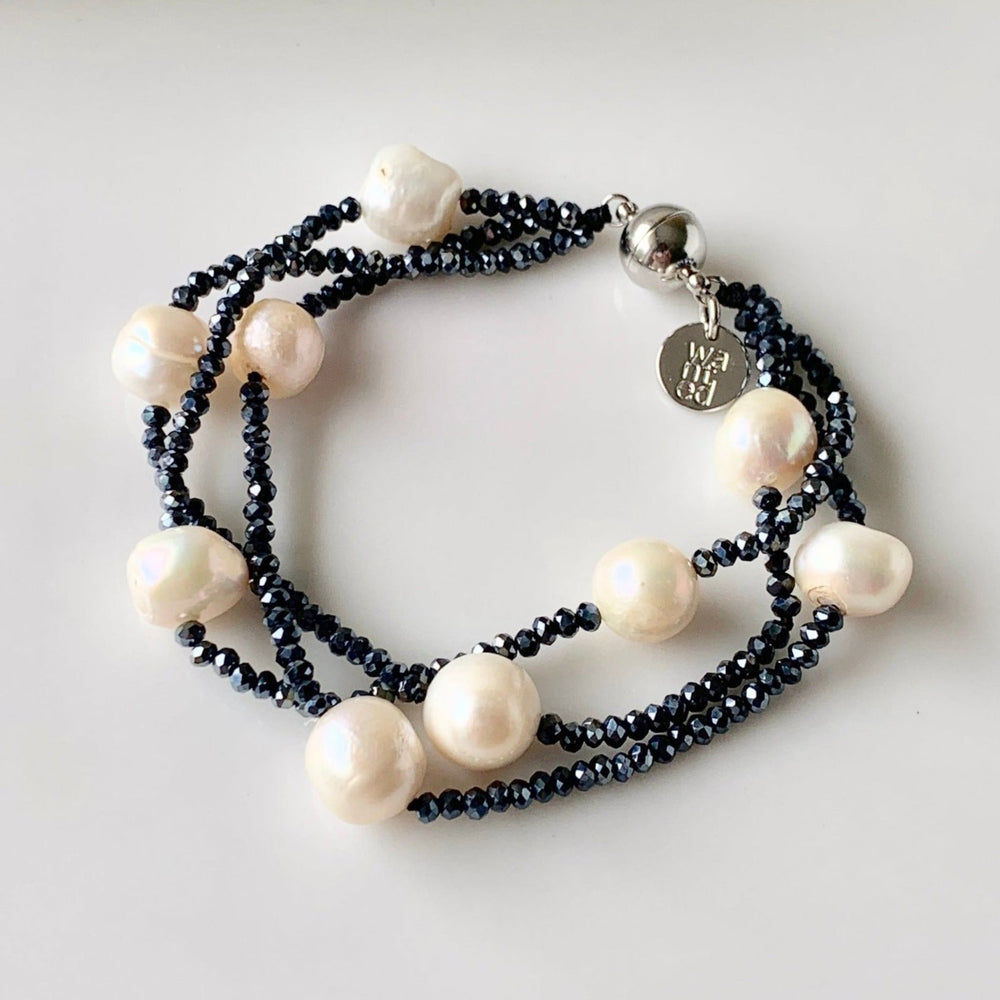 Three Strands of White Baroque Freshwater Pearls and 2mm Faceted Navy Crystals on this Bracelet with Strong Secure Magnetic Clasp for Easy Wear.