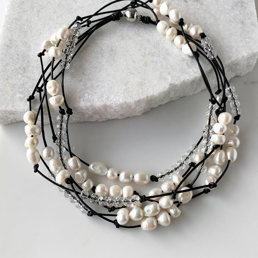
                      
                        White Baroques Freshwater Pearls and White Faceted Crystals on Black Knotted Leather For a Long  39” Necklace with Strong Secure Magnetic Clasp for Easy Wear. Shown Doubed
                      
                    
