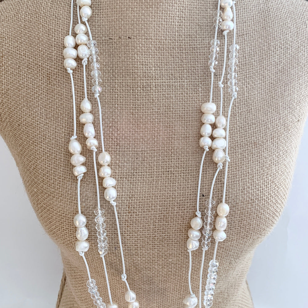 
                      
                        White Baroques Freshwater Pearls and White Faceted Crystals on White Knotted Leather For a Long  39” Necklace with Strong Secure Magnetic Clasp for Easy Wear. On Bust
                      
                    