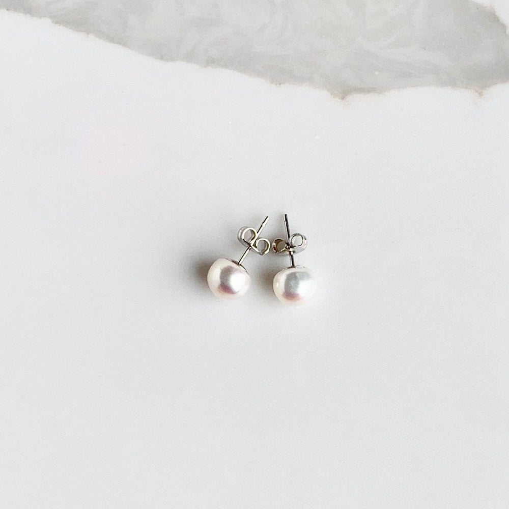
                      
                        These Pretty White 8mm Freshwater Pearl Stud Earrings are on Sterling Silver Post and Butterfly.  A Fan Favorite!
                      
                    
