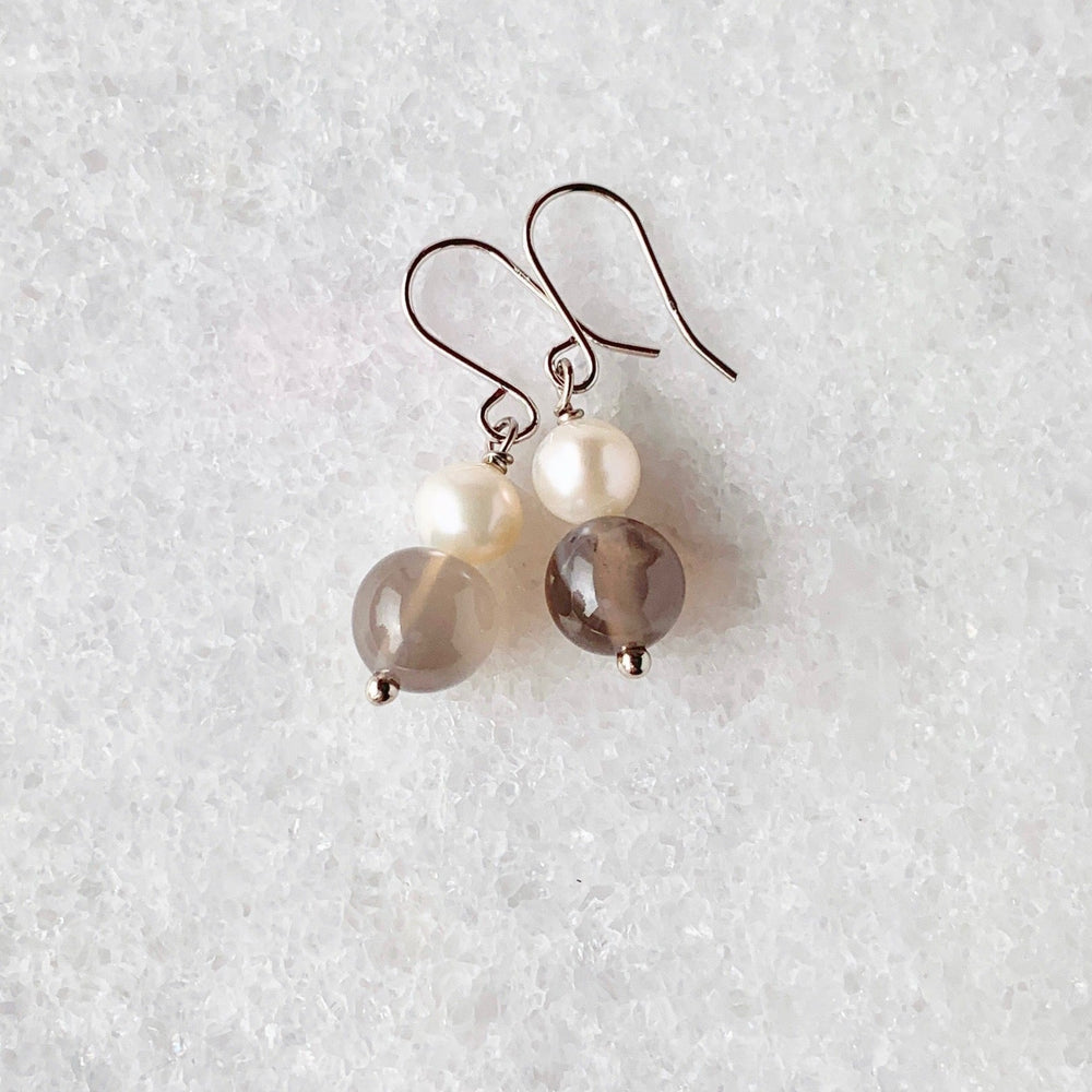 
                      
                        White Freshwater Pearl and Grey Agate Stack 1.25” Earring on Sterling Silver Hooks. 
                      
                    