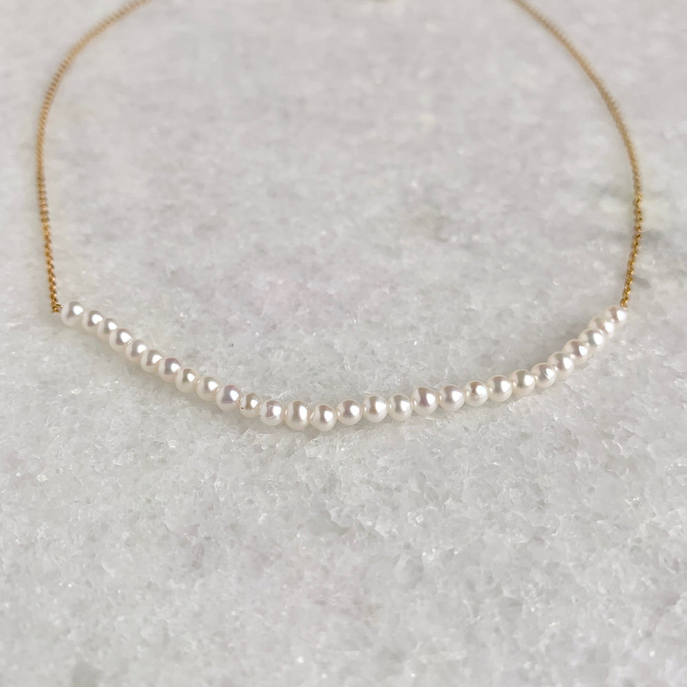 
                      
                        3mm Freshwater White Pearls on Yellow Gold 18” Chain with 1.25” Extender for this Delicate and Classic Necklace which can also be Worn Layered with other Favorites.  Focus on Lustrous Pearls
                      
                    