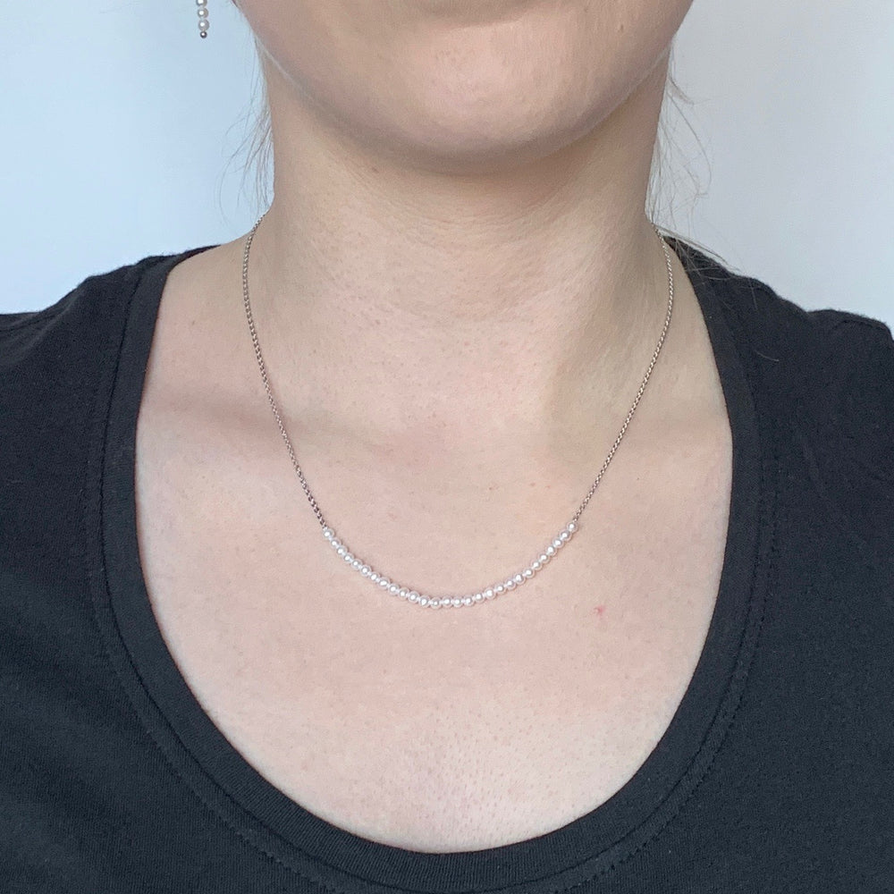 
                      
                        3mm Freshwater White Pearls on White Gold 18” Chain with 1.25” Extender for this Delicate and Classic Necklace which can also be Worn Layered with other Favorites.  On Model
                      
                    